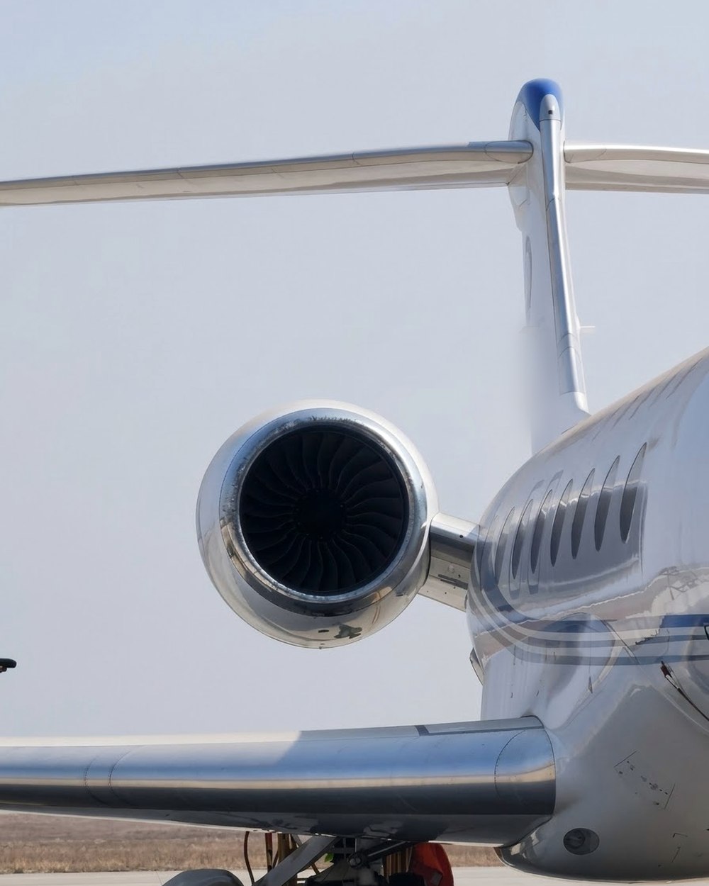 Business jet engine and tail on the ramp